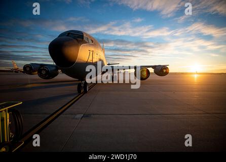 A U.S. Air Force KC-135R Stratotanker sits on the flight line during sunrise. Stock Photo