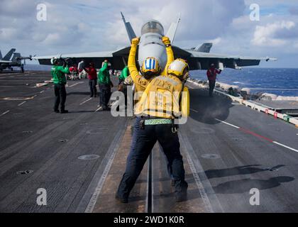 Sailors assigned to the aircraft carrier USS Carl Vinson conduct flight operations. Stock Photo