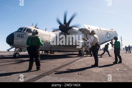 Sailors direct a C-2A Greyhound aboard the aircraft carrier USS George H.W. Bush. Stock Photo