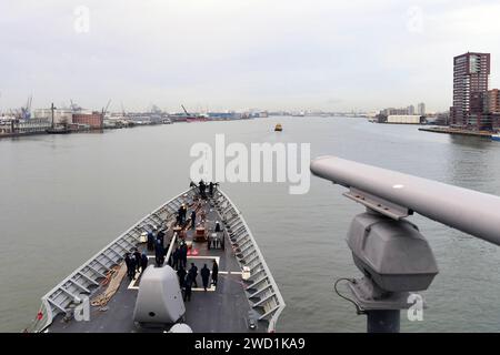 The guided-missile cruiser USS Hue City departs Rotterdam, Netherlands. Stock Photo