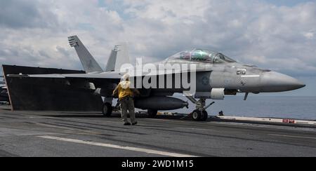An F/A-18F Super Hornet prepares for launch aboard the aircraft carrier USS George H.W. Bush. Stock Photo
