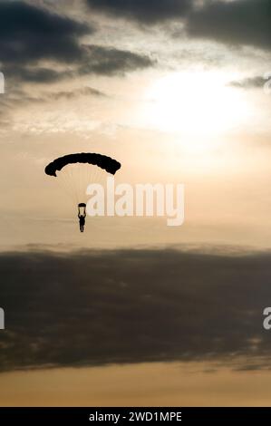 An Explosive Ordnance Disposal technician descends during military free-fall training in Suffolk, Virginia. Stock Photo