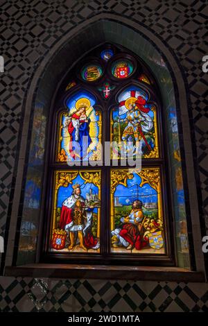 Stained glass window in Chapel of Our Lady of Pena in National Palace of Pena in Sintra, Portugal. Nave window from Kellner workshop in Nuremberg from Stock Photo