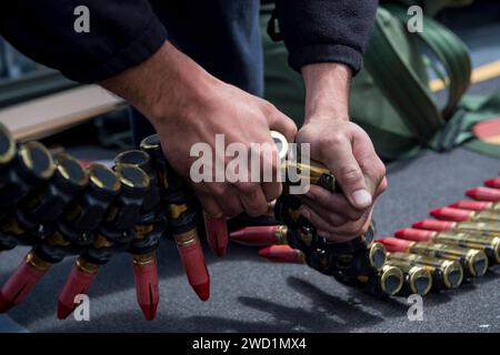 Fire Controlman prepares ammunition for the phalanx close-In weapons. Stock Photo