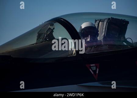 A pilot taxis an F/A-18E Super Hornet aboard the aircraft carrier USS Dwight D. Eisenhower. Stock Photo