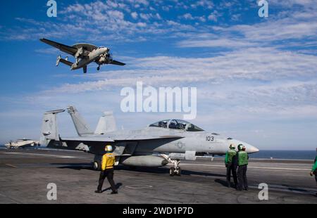 An F/A-18F Super Hornet taxis across the flight deck aboard USS Dwight D. Eisenhower. Stock Photo