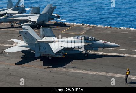 An F/A-18F Super Hornet takes off from the Nimitz-class aircraft carrier USS George H.W. Bush. Stock Photo