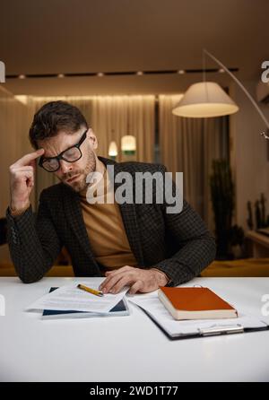 Portrait of serious focused business man working with documents Stock Photo