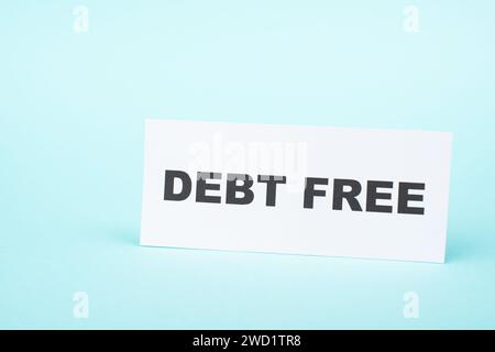 Debt free in process, ending credit payments and bank loans, financial freedom, message on paper Stock Photo