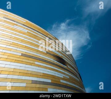 Colorful cladding and modern architecture of the Derby Arena / Velodrome against a blue sky, Derby, England, UK Stock Photo