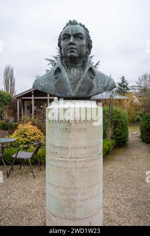 Bust or statue of William Cobbett 1763 - 1835, champion of democracy, in the garden at the Museum of Farnham, Surrey, England, UK Stock Photo