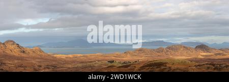 Looking towards Achnaha, a remote village in the Ardnamurchan Peninsula with the Islands of Rum and Eigg in the background. Stock Photo