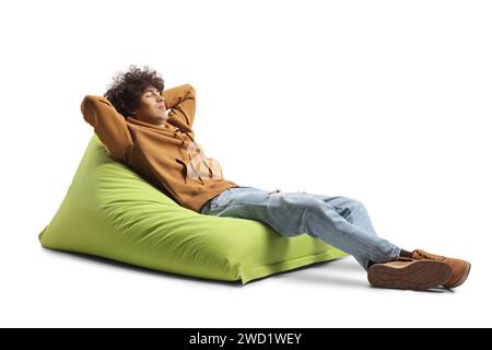 Guy sleeping on a green bean bag armchair isolated on white background Stock Photo