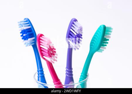 Four colourful plastic toothbrushes Stock Photo