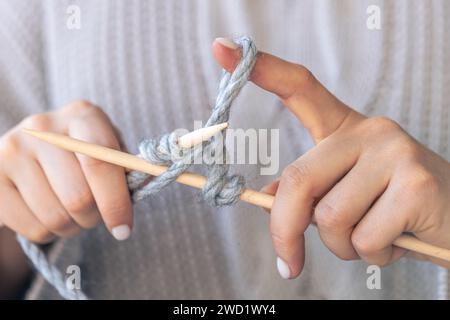 Close-up of hands knitting using circular needles. Stock Photo