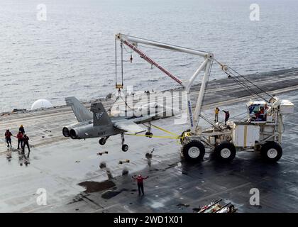 U.S. Navy Sailors demonstrate the operation of the mobile crash crane aboard USS Nimitz. Stock Photo