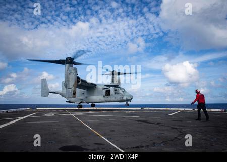 A MV-22B Osprey tiltrotor aircraft prepares to land on USS New Orleans. Stock Photo