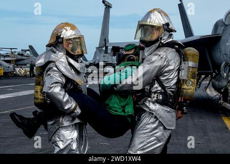 US Navy Crash and Salvage Team Members aboard USS Boxer (LHD 4 ...