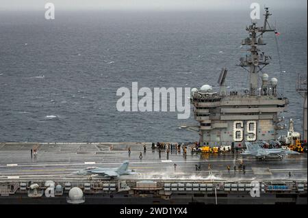 An F/A18F Super Hornet takes off from the flight deck of USS Dwight D. Eisenhower. Stock Photo