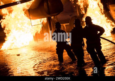 U.S. Air Force and civilian firefighters put out a blaze at Moody Air Force Base, Georgia. Stock Photo