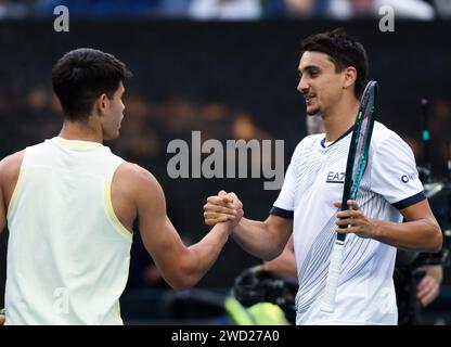 Melbourne, Australia. 18th Jan, 2024. Carlos Alcaraz (L) of Spain and Lorenzo Sonego of Italy shake hands after their men's singles second round match at Australian Open tennis tournament in Melbourne, Australia, Jan. 18, 2024. Credit: Ma Ping/Xinhua/Alamy Live News Stock Photo