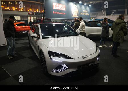 Brussels, Belgium. 17th Jan, 2024. Visitors view a BYD Seal electric car displayed at Brussels Auto Show in Brussels, Belgium, Jan. 17, 2024. This year's Brussels Auto Show (BAS) kicked off on Wednesday in the Belgian capital, presenting over 400 cars, motorcycles, and trucks from more than 150 companies, putting sustainable mobility in the limelight. Credit: Zhao Dingzhe/Xinhua/Alamy Live News Stock Photo