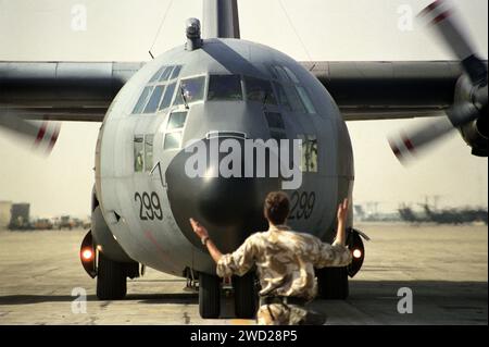 23rd January 1991 An RAF C130 Hercules transport plane is guided as it taxis at Dhahran International Airport during the Gulf War. Stock Photo