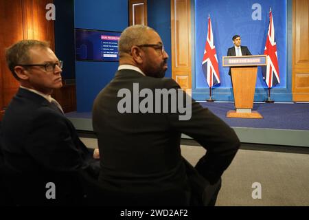 Minister of State for Countering Illegal Migration Michael Tomlinson (left) and Home Secretary James Cleverly, during a press conference in Downing Street, London, held by Prime Minister Rishi Sunak after he saw the Safety of Rwanda Bill pass its third reading in the House of Commons by a majority of 44 on Wednesday evening. Picture date: Thursday January 18, 2024. Stock Photo