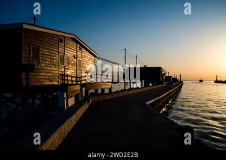 Sunrise over the port of Cesenatico, a holiday center on the Romagna Riviera (Italy), famous for good food and entertainment Stock Photo