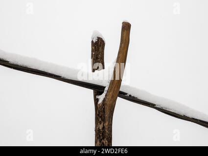 A cable suspended on an old rustic wooden support Stock Photo