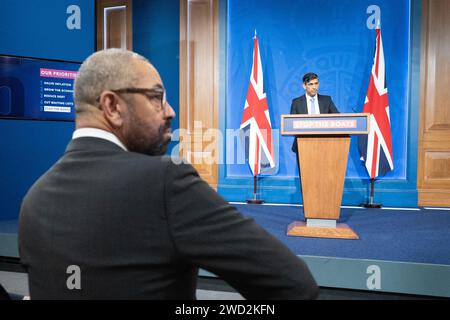 Home Secretary James Cleverly, attends a press conference in Downing Street, London, held by Prime Minister Rishi Sunak after he saw the Safety of Rwanda Bill pass its third reading in the House of Commons by a majority of 44 on Wednesday evening. Picture date: Thursday January 18, 2024. Stock Photo