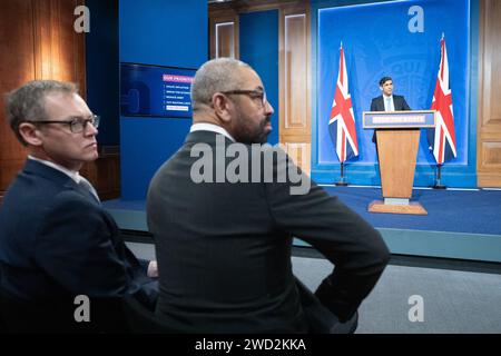 Minister of State for Countering Illegal Migration Michael Tomlinson (left) and Home Secretary James Cleverly, attend a press conference in Downing Street, London, held by Prime Minister Rishi Sunak after he saw the Safety of Rwanda Bill pass its third reading in the House of Commons by a majority of 44 on Wednesday evening. Picture date: Thursday January 18, 2024. Stock Photo