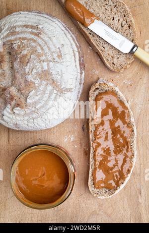 Smooth peanut butter on Sourdough bread Stock Photo