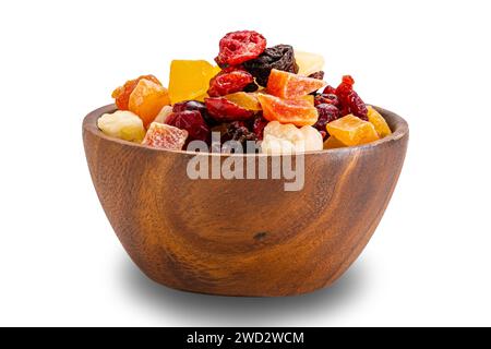 View of various dried tropical fruit in wooden bowl isolated on white background with clipping path. Stock Photo