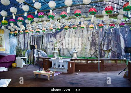 Sangju City, South Korea - November 17th, 2023: A small wooden-floored prayer area in front of the Seated Maae Bodhisattva, an ancient Buddha image ca Stock Photo