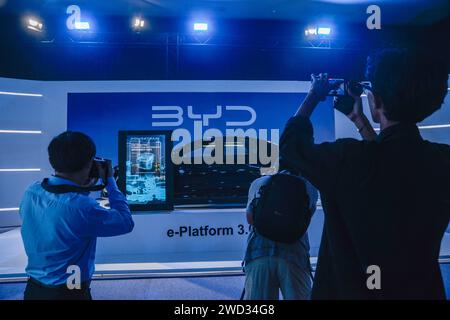 Jakarta, Indonesia. 18th Jan, 2024. Journalists take photos and videos of a new car outside the venue of BYD grand launch in Jakarta, Indonesia, Jan. 18, 2024. China's BYD, a global leader in the sale of pure electric vehicles (EV), launched three new electric passenger cars, SEAL, Atto 3, and Dolphin, in Jakarta, Indonesia on Thursday to further expand in the Southeast Asia region. Credit: Xu Qin/Xinhua/Alamy Live News Stock Photo