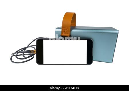 Smartphone with a blank white screen is being charged from a power bank via a USB cable, isolated on a white background. Mobile power supply Stock Photo
