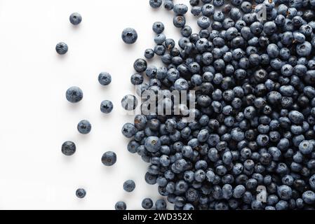 Blueberries scattered on a white background. View from above. Stock Photo