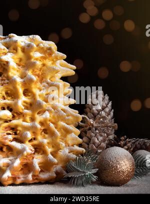 Christmas tree cake decorated with powdered sugar. Close-up. Happy New Year concept. Stock Photo