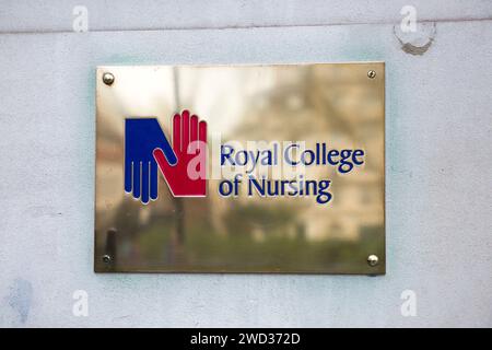 Brass name plate / plaque outside the offices of / on office / Headquarters / head office of The RCN / Royal College of Nursing. Cavendish Square. London. (137) Stock Photo