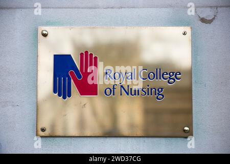 Brass name plate / plaque outside the offices of / on office / Headquarters / head office of The RCN / Royal College of Nursing. Cavendish Square. London. (137) Stock Photo