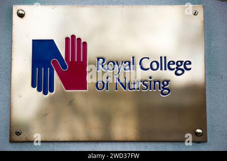 Brass name plate / plaque outside the offices of / on office / Headquarters / head office of The RCN / Royal College of Nursing. Cavendish Square. London. (137) Stock Photo