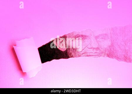 Torn paper with Portrait of U.S. president Abraham Lincoln. Stock Photo