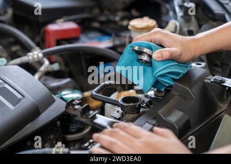 A woman is opening radiator cap Stock Photo