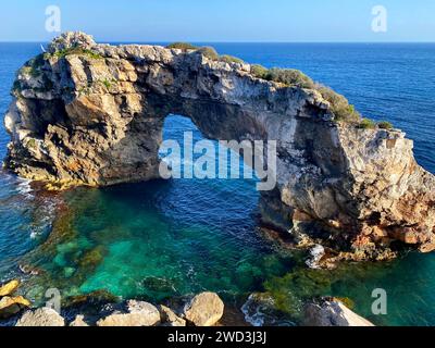 Beautiful view on natural rock arch (13 meters high) at viewpoint, Mirador Es Pontas on Mallorca island, Santanyí, Balearic islands, Spain Stock Photo