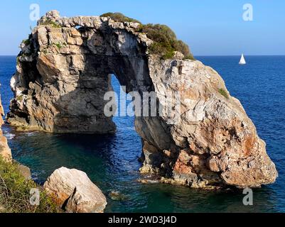 Beautiful view on natural rock arch (13 meters high) at viewpoint, Mirador Es Pontas on Mallorca island, Santanyí, Balearic islands, Spain Stock Photo