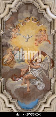 ROME, ITALY - SEPTEMBER 1, 2021: The ceiling fresco of Holy Spirit among the angels in church Chiesa di Santa Maria Annunziata in Borgo Stock Photo