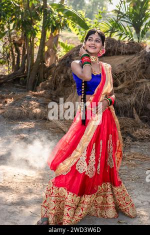 Indian rural girl smiling and enjoying nature. Freedom concept. Stock Photo