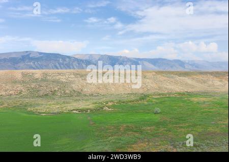 Red Lodge, Montana, USA - Foothills of the Beartooth Mountains, Rockies, with a valley flanked by shrub land near Red Lodge, Montana, USA. Stock Photo