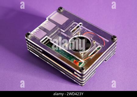 a Raspberry Pie 3 computer, on a mouve background, studio photography Stock Photo